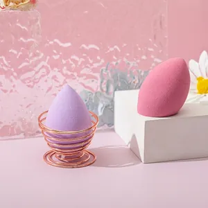 Makeup sponge set with purple teardrop, pink slanted sponges and rose gold metal stand