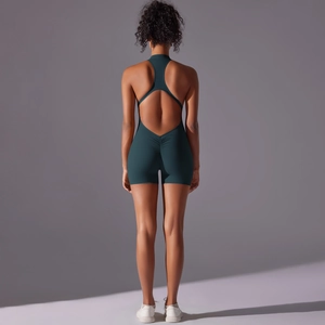 Detail of deep green backless yoga bodysuit with scrunch butt lifting design