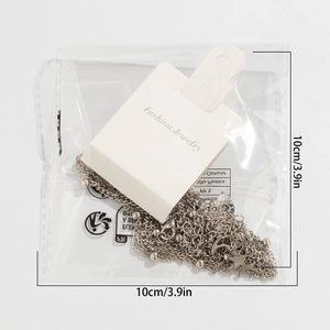 Detail of star and moon necklace in 10cm x 10cm fashion jewelry packaging bag