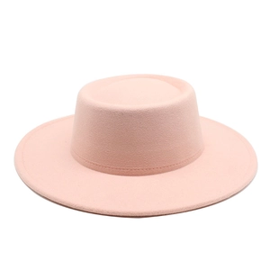 Detailed view of pink wool boater hat featuring wide brim and cylindrical crown