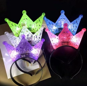 Five assorted LED crown headbands glowing in green blue white purple and rose pink colors