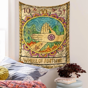 Macro shot of Wheel of Fortune tarot tapestry texture on bedroom wall