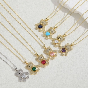 Macro view of crystal bear pendants featuring heart-shaped stones in multiple colors