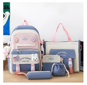 Blue and pink student backpack set including matching tote, pencil case, and plush charm