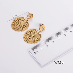 Detailed view of monstera leaf earrings in gold with measurements 3.5cm and 6g weight