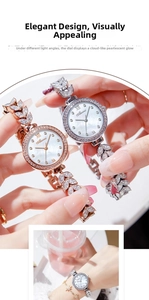 Detail of mother of pearl dial and crystal leaf bracelet on elegant women's watch