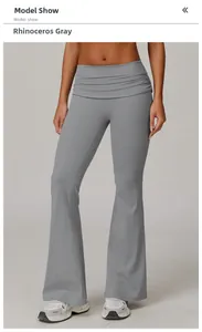 Detail view of high waist wide waistband on rhino gray flare yoga pants with soft texture