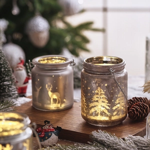 Christmas glass jar candle holder with reindeer and tree patterns and warm LED light