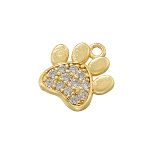 Close-up of golden paw print pendant charm with sparkling inlaid rhinestones