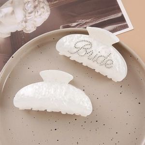Elegant white pearlescent acrylic hair claw clips with Bride rhinestone embellishment