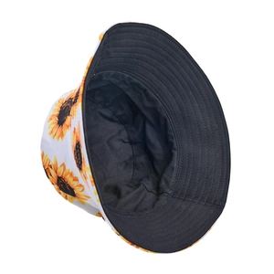 Reversible bucket hat for women with sunflower print and black interior for sun protection