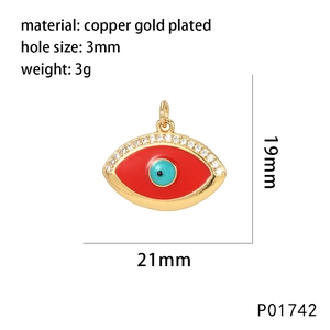 Macro detail of red and blue enamel evil eye pendant with cubic zirconia and dimensions