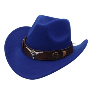 Detail of royal blue felt cowboy hat featuring a leather band with silver bull head ornament