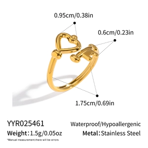 Detailed view of 18K gold stainless steel ring with unique heart and key design