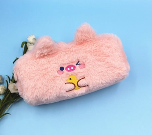 Close-up of pink plush pencil case featuring cute pig and duck embroidery details