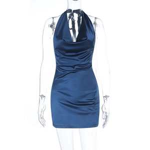 Detail view of navy blue satin halter dress featuring draped cowl neck and silk-like texture