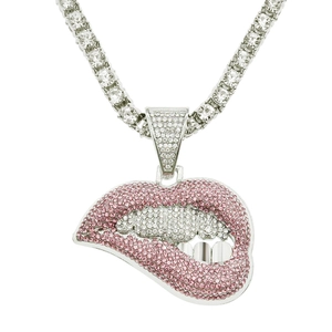 Detailed close-up of pink and white crystal encrusted lip pendant on silver tennis chain