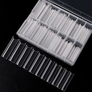Detailed view of clear C-curve French nail tips in a ten-compartment storage box