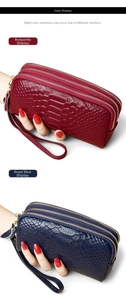 Detail view of wine red and royal blue triple zipper clutches with crocodile texture