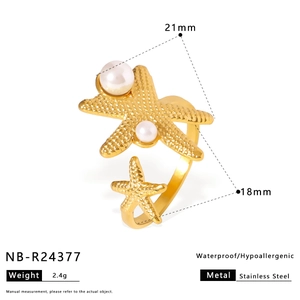 Detailed view of golden stainless steel starfish ring featuring an elegant pearl accent