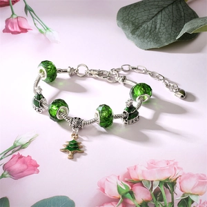 Christmas beaded charm bracelet with green crystal beads and silver tree pendant