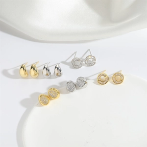 Variety of vintage hollow oval and teardrop stud earrings in gold and silver finish