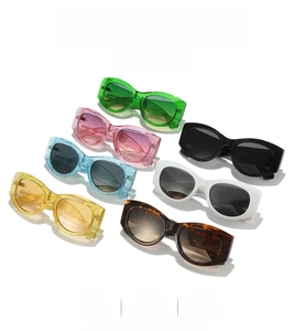 Close-up of retro oval sunglasses with glitter frames in diverse vibrant colors