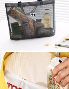 Detail of grey mesh beach bag featuring large capacity and durable nylon net texture