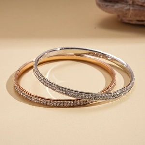 Minimalist geometric round bangles with sparkling crystals in rose gold and silver finishes