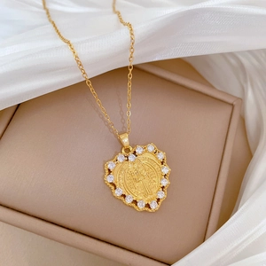 Luxurious gold heart pendant necklace with sparkling crystals and embossed portrait