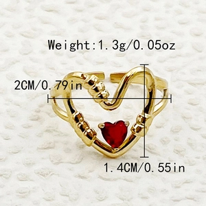 Macro shot of gold heart chain ring with red gemstone and dimensions measurement