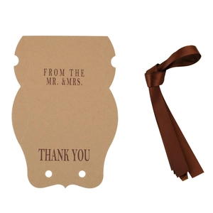 Vintage kraft paper pillow gift box with brown ribbon and Thank You greeting card