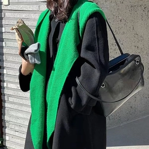 Chic green knitted scarf hood shawl paired with black coat for autumn winter fashion look