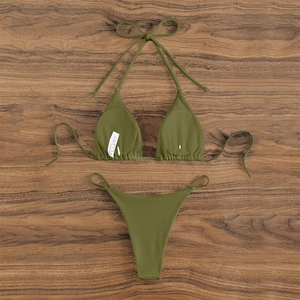 Detailed flat lay of olive green ribbed bikini set with halter top and adjustable ties