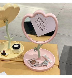 Pink flower shaped tabletop makeup mirror with storage tray and vanity accessories