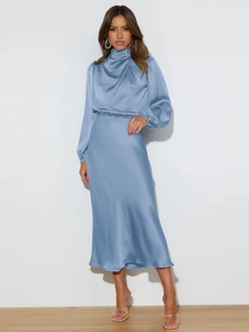 Detail of elegant light blue satin dress featuring a high neck and smooth silk-like fabric