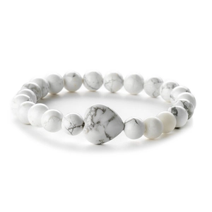 Natural white howlite beaded bracelet featuring round stones and a central heart charm