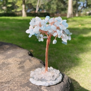 Aquamarine crystal tree of life with copper wire on a natural crystal base for home decor