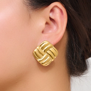 Minimalist square earrings with golden woven texture shown on ear for a retro style