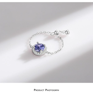 Macro shot of S925 sterling silver chain ring with purple zircon and white stones