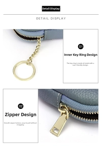 Detail of leather coin purse with golden key ring and smooth zipper design