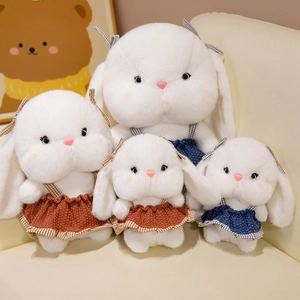 Cute white plush bunny toys wearing checkered dresses in multiple sizes for kids