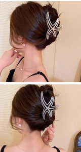 Detail of starfish hair claw clip with pearls and rhinestones on silver metal base