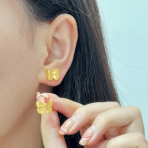 Fashionable 18K gold butterfly stud earrings for women with detailed wing texture