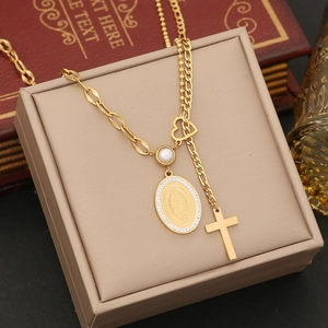 Detail of gold layered necklace with Virgin of Guadalupe and cross pendants on display