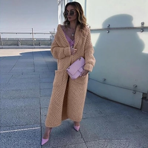 Women's long knit cardigan with lapels and oversized fit in apricot color