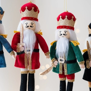 Festive Nutcracker soldier ornaments in red and blue for Christmas tree decoration