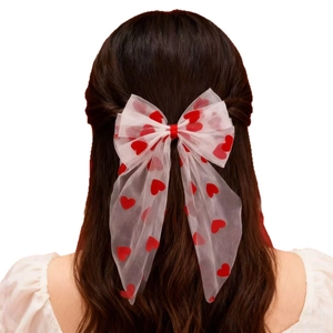 Red heart print white tulle bow hair clip with long ribbons on female model back