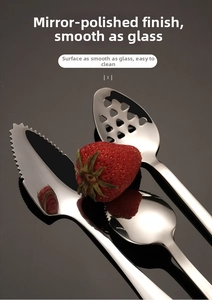 Macro shot of mirror-polished stainless steel baby spoon with jagged edges and fruit hole