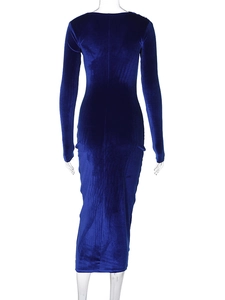 Detail of slim-fit dark blue velvet long-sleeve dress with elegant ruching on the back